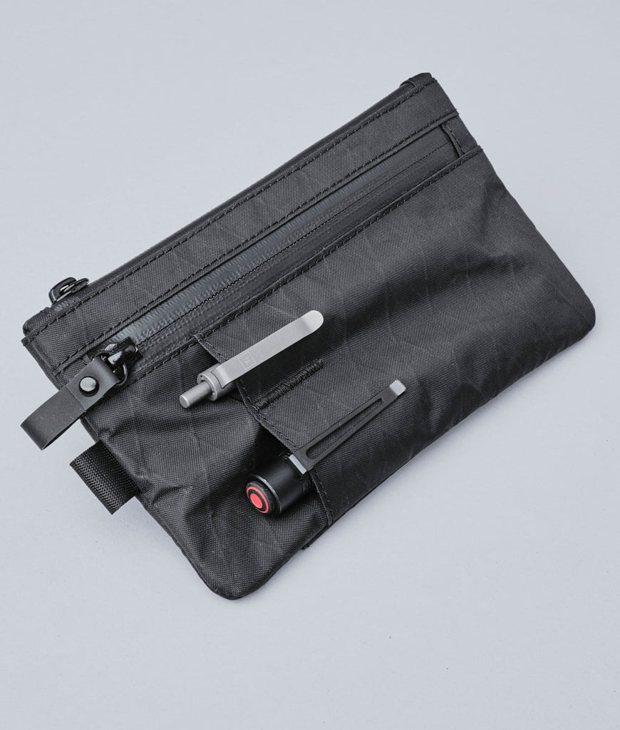 ALPAKA Zip Clutch